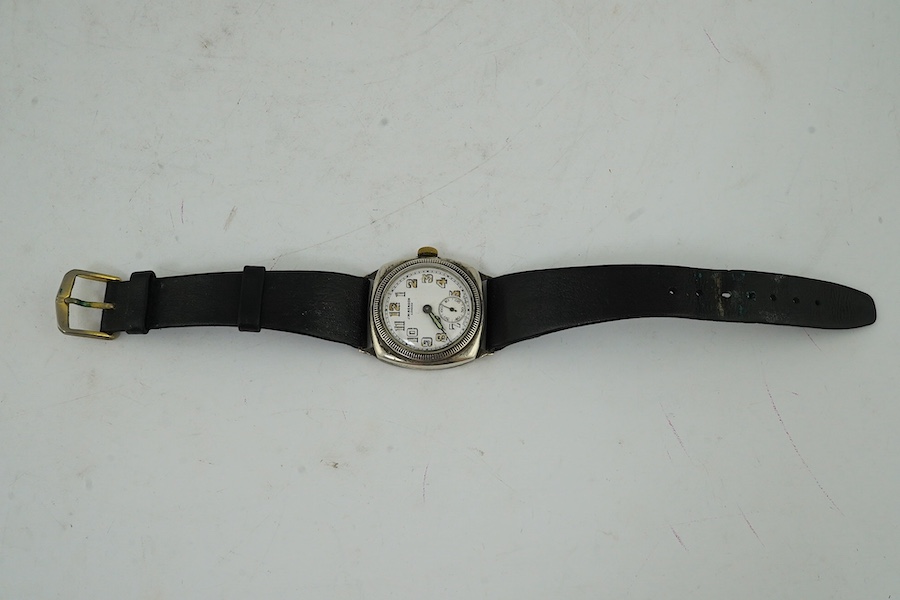 A George V silver military? manual wind wrist watch, case import marked for London, 1915, and a silver J.W. Benson manual wind wrist watch. Condition - poor to fair